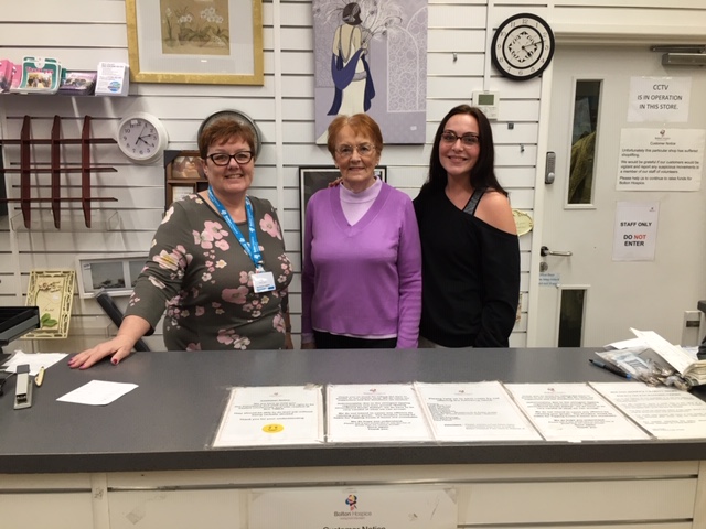 Shop volunteers at the till