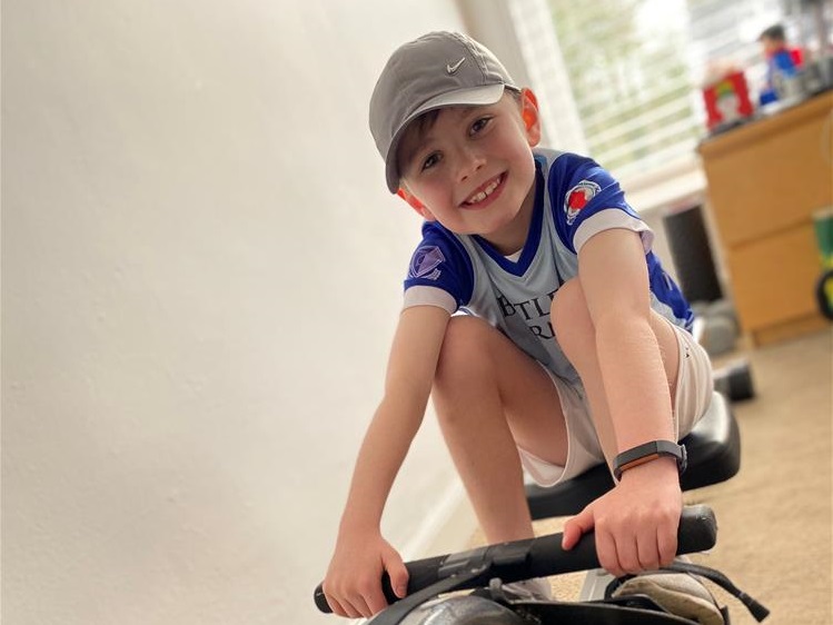 Oliver on rowing machine