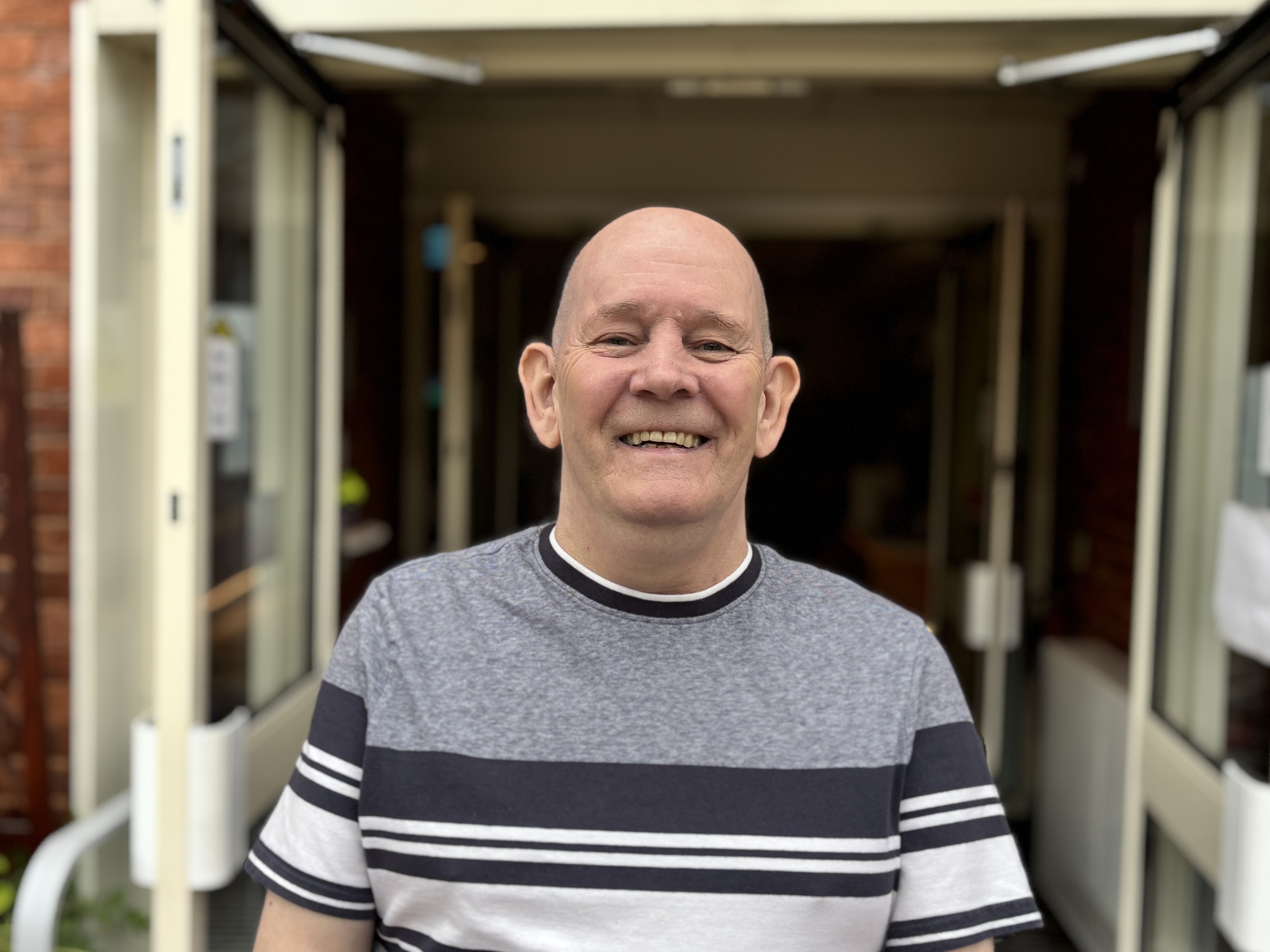 david stood outside Bolton Hospice wellbeing hub