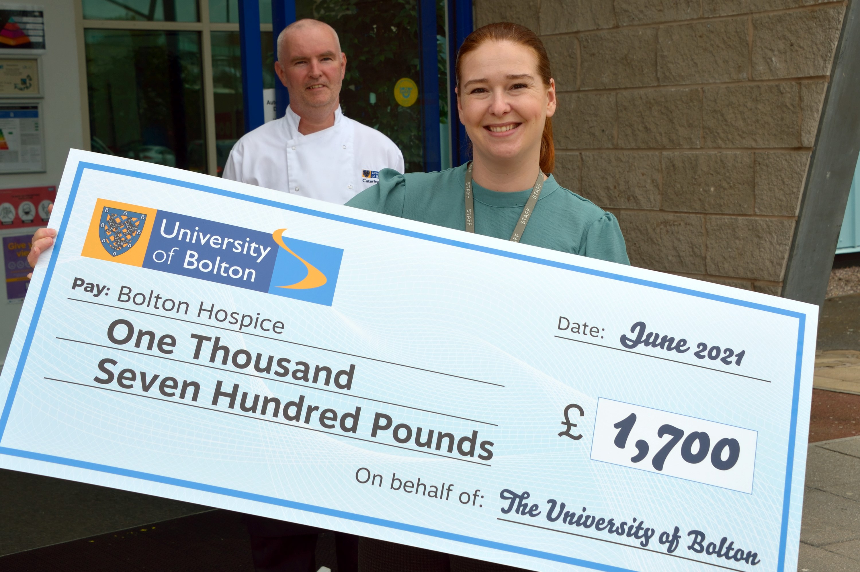 Woman holding large cheque for £1,700