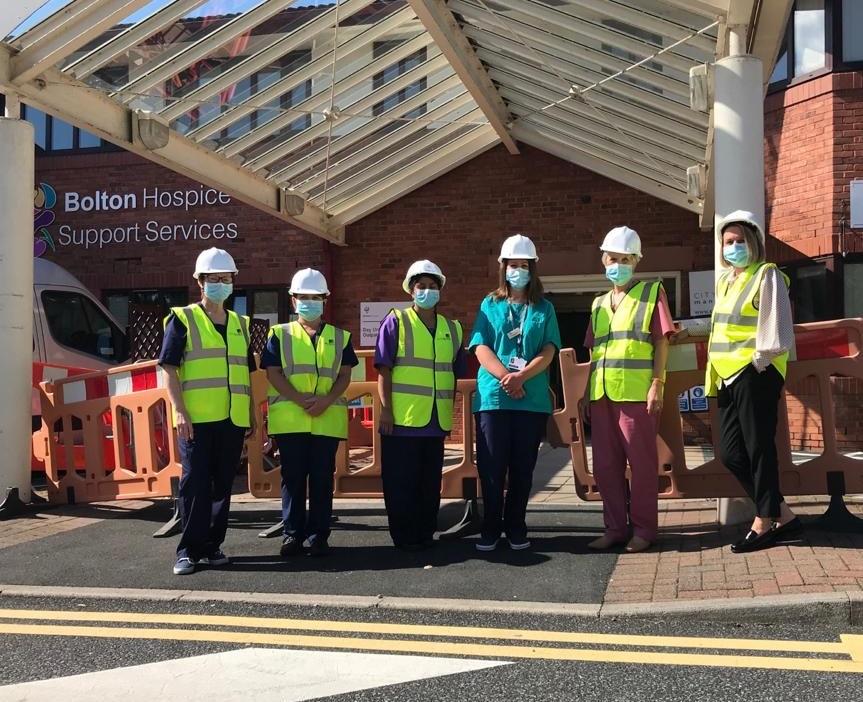 staff outside wellbeing hub site