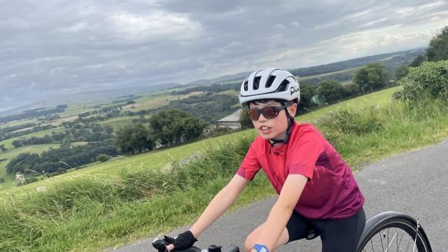 Jack cycling on country road 
