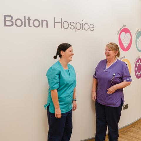 nurses talking in family lounge 